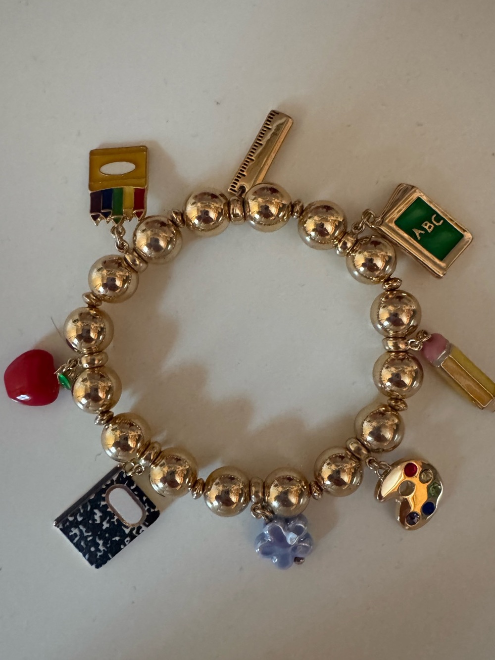 Betsey Johnson school teacher charm bracelet. Gold plated school teacher charm.